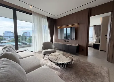 Modern living room with large windows and elegant decor in a luxury apartment