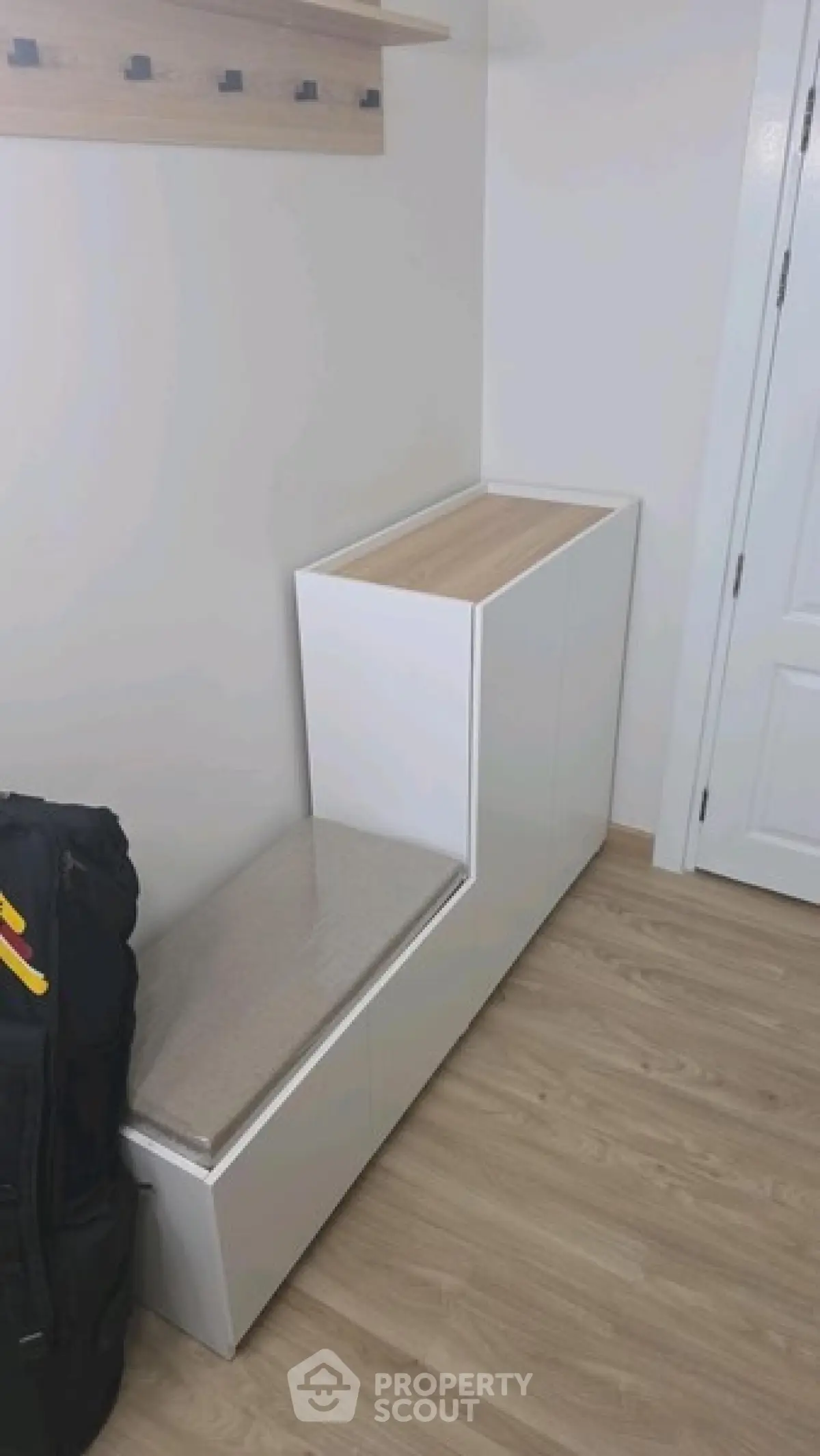 Modern interior with sleek storage bench and wooden flooring