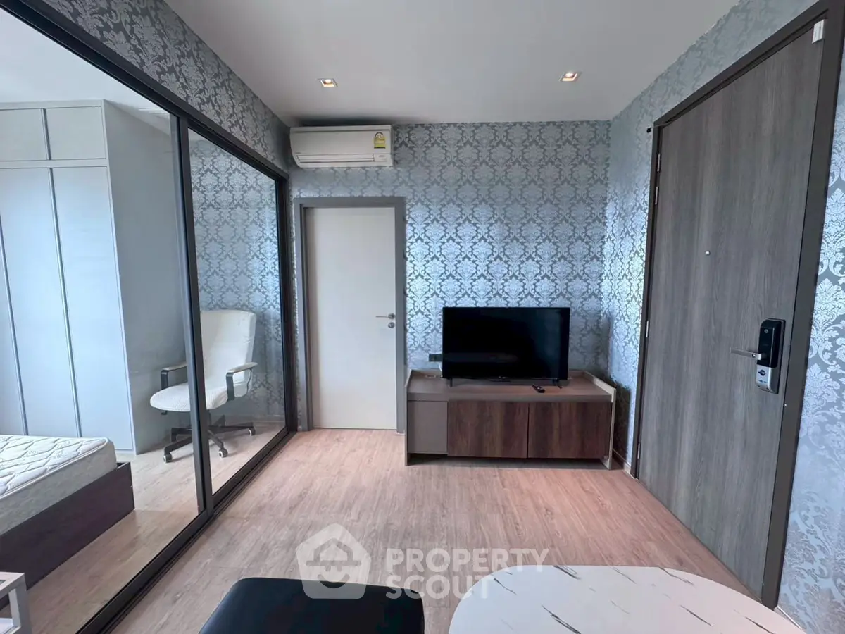 Modern living room with stylish wallpaper and sleek furniture