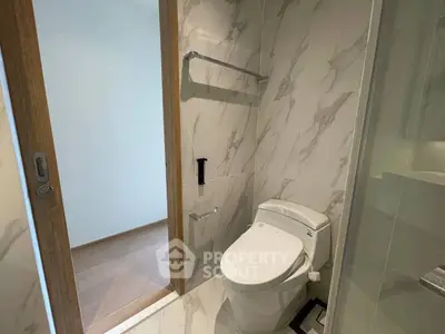 Modern bathroom with sleek marble tiles and contemporary fixtures