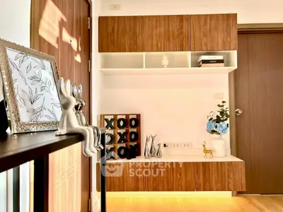 Stylish modern living room with elegant decor and wooden cabinetry, perfect for contemporary living.
