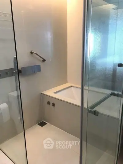 Modern bathroom with sleek glass shower and minimalist design