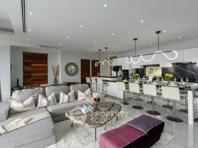 Luxurious open-plan living room with modern kitchen and stylish decor