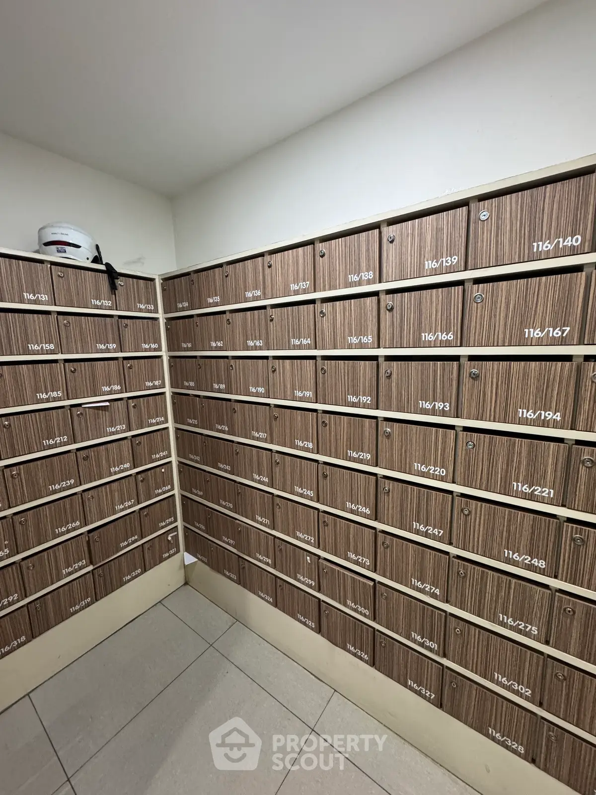 Modern apartment building mailroom with organized mailboxes