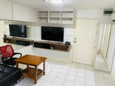 Cozy living room with modern TV setup and stylish furniture