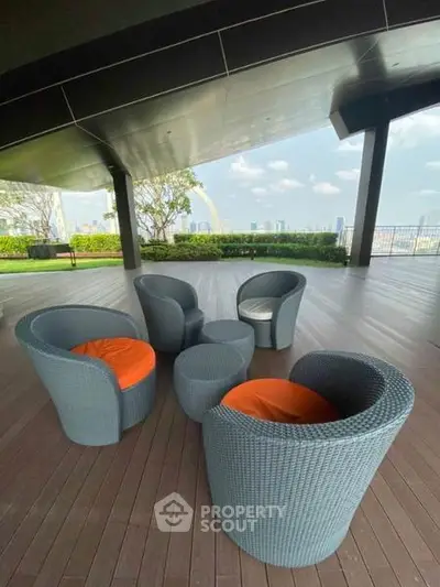Stylish outdoor seating area with city view, perfect for relaxation and gatherings.