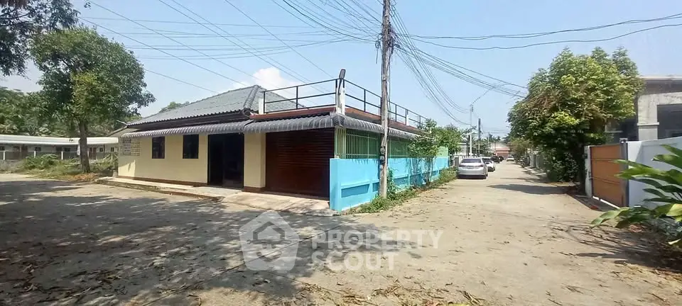 Charming single-story home with rooftop terrace and spacious driveway in a serene neighborhood.