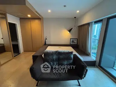 Modern bedroom with large windows and stylish decor in urban apartment