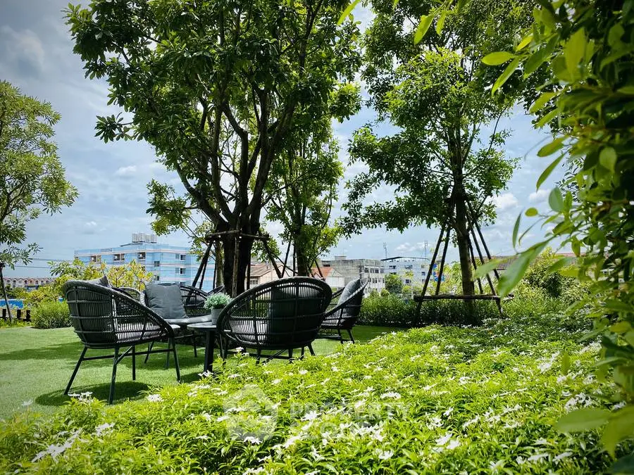 Lush garden with outdoor seating in a serene residential setting