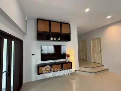 Modern living room with sleek TV setup and stylish decor