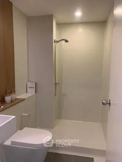 Modern bathroom with sleek shower and toilet design