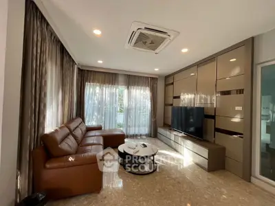 Luxurious living room with modern decor, leather sofa, and large TV unit, perfect for relaxation.