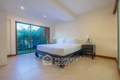 Spacious bedroom with garden view and elegant decor