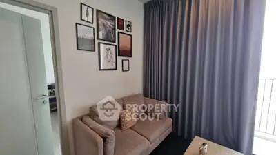 Cozy living room with modern decor and a comfortable sofa, perfect for relaxation.