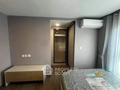 Modern bedroom with air conditioning and stylish furniture in a contemporary apartment.