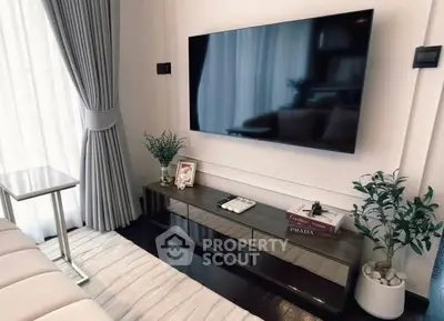 Modern living room with sleek TV setup and elegant decor