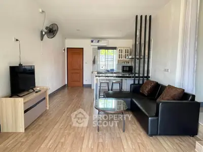 Spacious modern living room with open kitchen and stylish decor