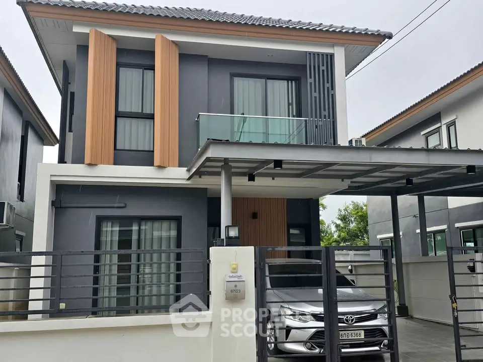 Modern two-story house with carport and sleek exterior design