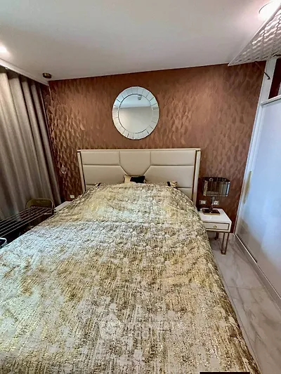 Luxurious bedroom with elegant decor and plush bedding