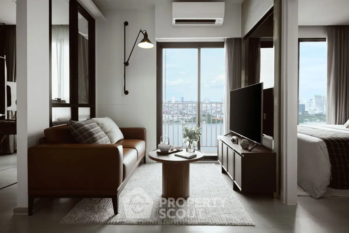 Modern living room with city view, stylish furniture, and natural light