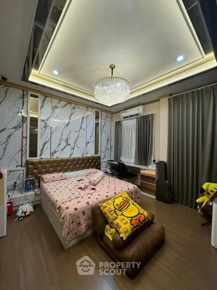 Luxurious bedroom with elegant chandelier and modern decor