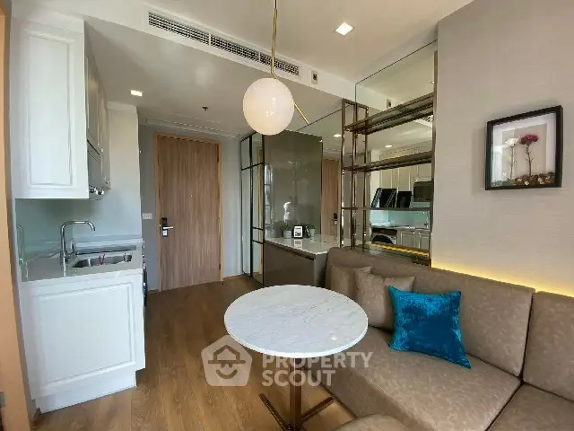 Modern compact living room with kitchenette and stylish decor