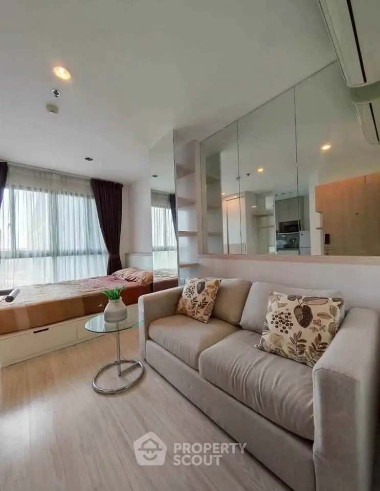 Modern studio apartment with cozy living area and stylish decor