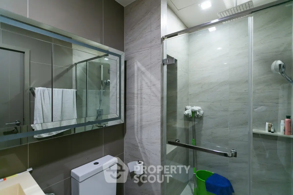 Modern bathroom with glass shower and sleek design