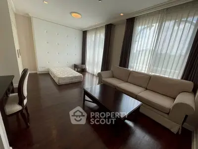 Spacious living room with elegant sofa and natural light
