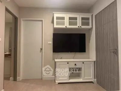 Modern living room with sleek TV unit and neutral decor