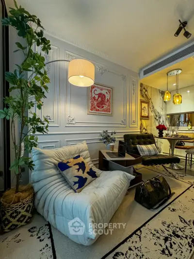 Stylish living room with modern decor, cozy seating, and elegant lighting in a contemporary apartment.