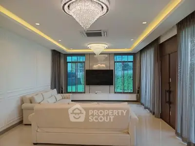 Luxurious living room with elegant chandeliers and modern decor