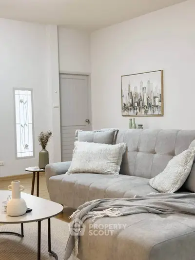 Stylish living room with modern gray sofa and elegant decor