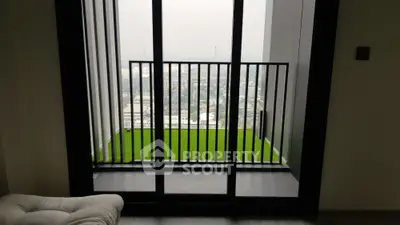 Modern apartment balcony with stunning city view and glass doors