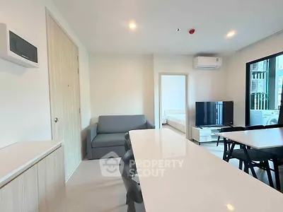 Modern living room with dining area and sleek furniture