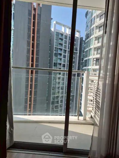 Modern high-rise apartment balcony with cityscape view