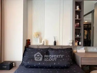 Modern bedroom with stylish decor and built-in shelving