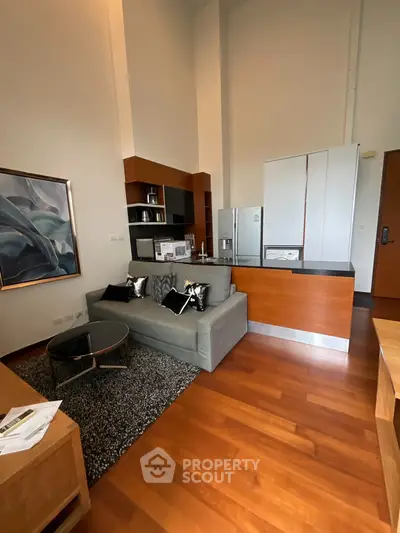 Modern living room with open kitchen and stylish decor