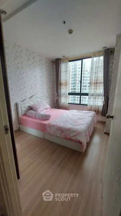 Cozy bedroom with large window and stylish decor in modern apartment