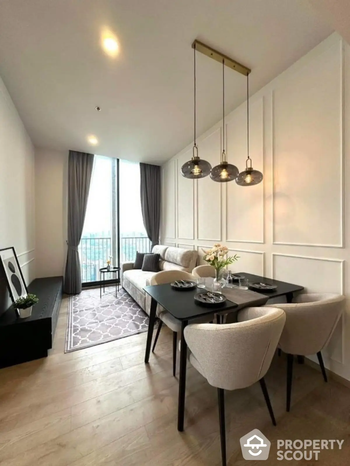 Modern living room with dining area and large window view