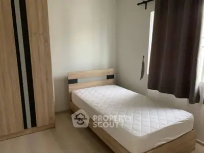 Cozy minimalist bedroom with single bed and wardrobe