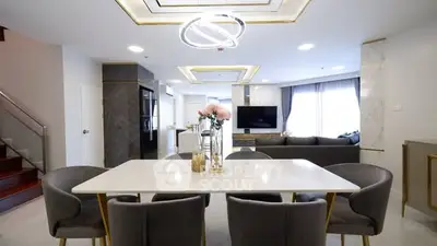 Luxurious modern living room with elegant dining area and stylish lighting