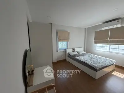 Spacious modern bedroom with minimalist design and natural light
