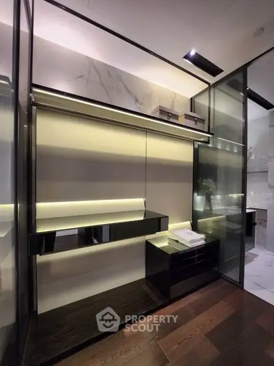 Luxurious modern walk-in closet with sleek shelving and ambient lighting