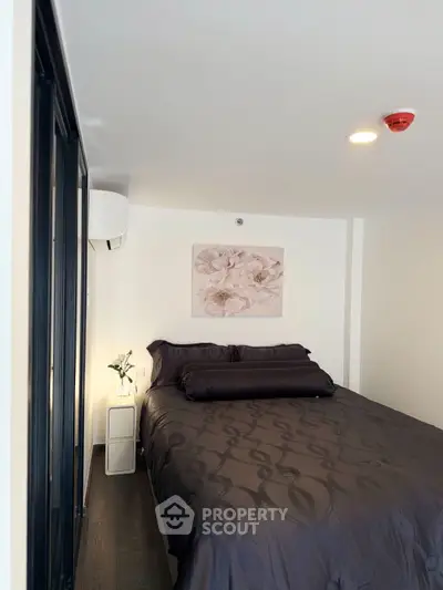 Cozy modern bedroom with elegant decor and soft lighting