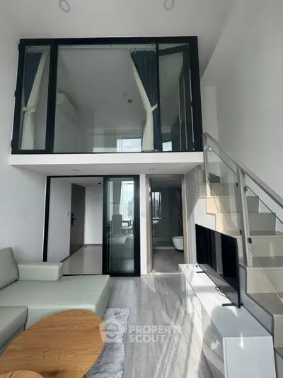 Modern duplex living room with mezzanine and sleek interior design