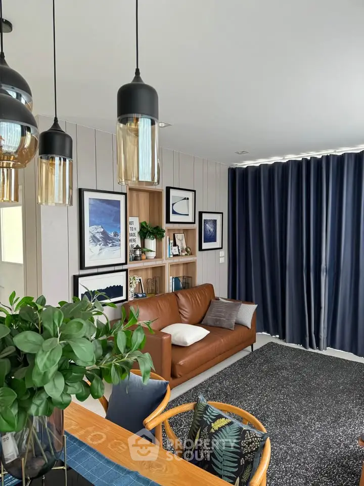 Stylish living room with modern decor, leather sofa, and elegant lighting