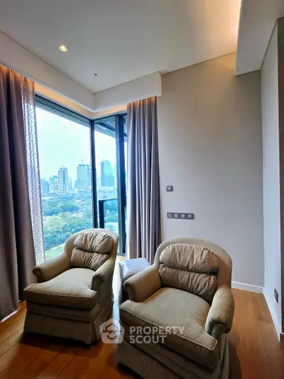 Luxurious corner unit with stunning city view and cozy seating area, perfect for relaxation.