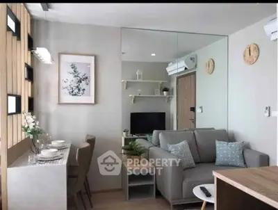 Modern living room with stylish decor and cozy seating in a contemporary apartment.