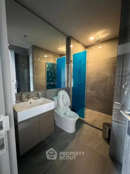 Modern bathroom with sleek design and glass shower enclosure